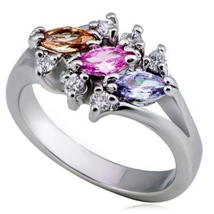 Lesklý kovový prsten - tři barevné zrnkové zirkony, čirý lem - Velikost: 55 obraz