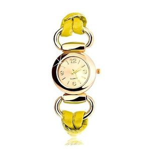 Náramkové hodinky, řemínek ze žlutého latexu, kulatý ciferník zlaté barvy obraz