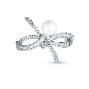 JwL Luxury Pearls Blyštivá dámská brož Mašle s pravou perlou a krystaly JL0842 obraz