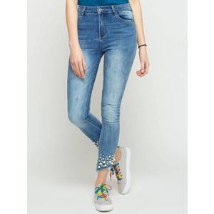 Jeans decorated with abrasions and pearls blue obraz