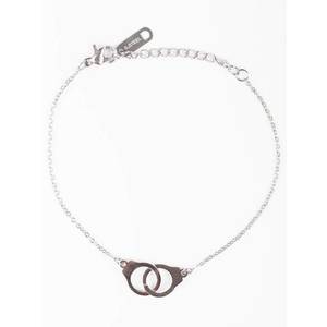 Bracelet on a silver chain decorated with handcuff pendants obraz